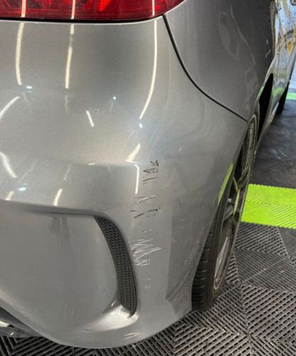 A silver car showing end of lease bumper scratches which need to be repaired at Them Paint Guys Vehicle Body Shop in Pontardawe, Swansea 