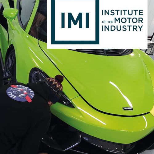 A repair is being carried out to a green Mclaren matching IMI standards and paid for via Payment Assist